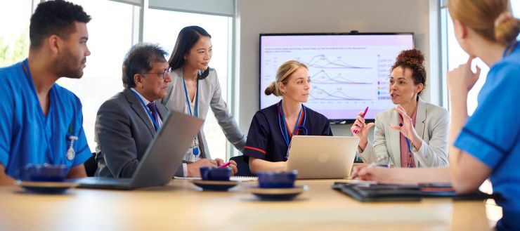 Clinical and management staff meeting on performance data